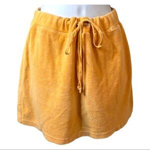 N. Y. L. orange velour skirt w/ hidden shorts. Elastic waist w/ tie belt. SZ M.